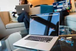 Person working on a laptop, focused on data science